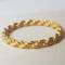 Muja Juma: Ring gold braided band